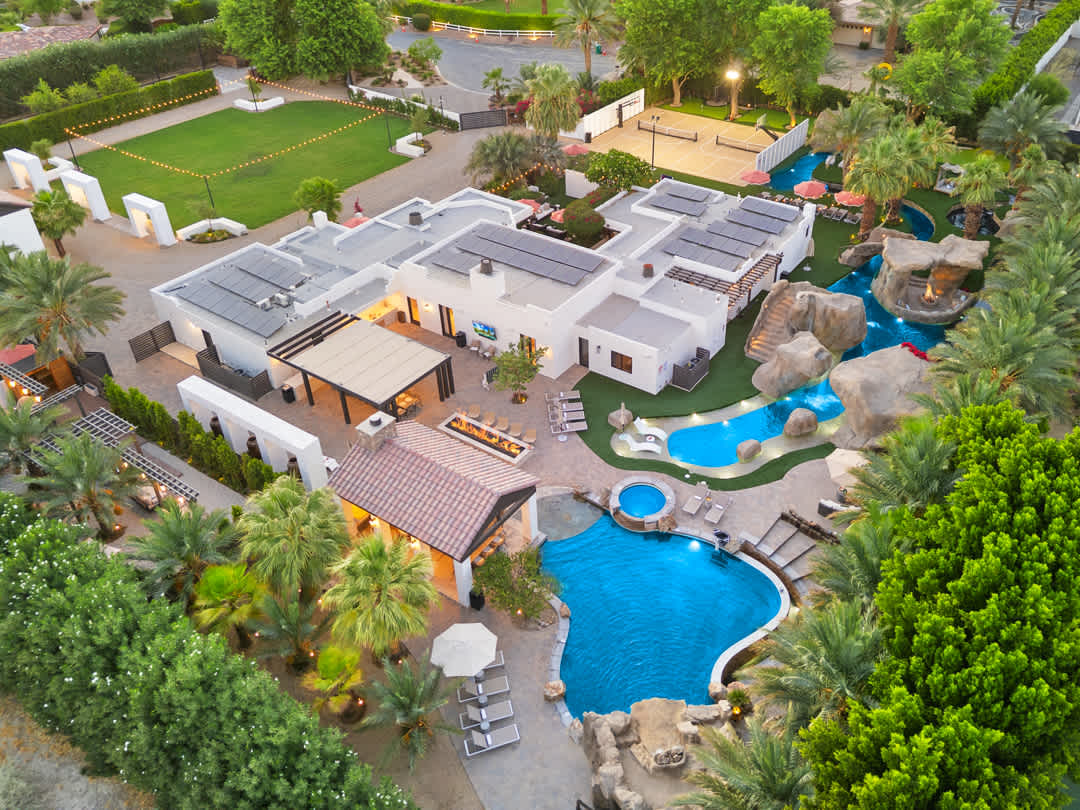 Wandery Ranch’s estate, pools, lazy river, and palm trees